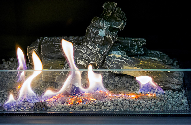 Close-up of gas fireplace.