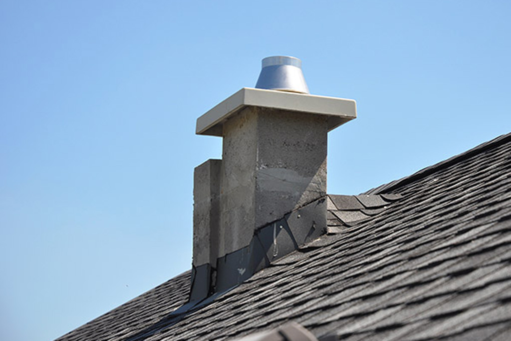 Close-up of chimney liner on roof.